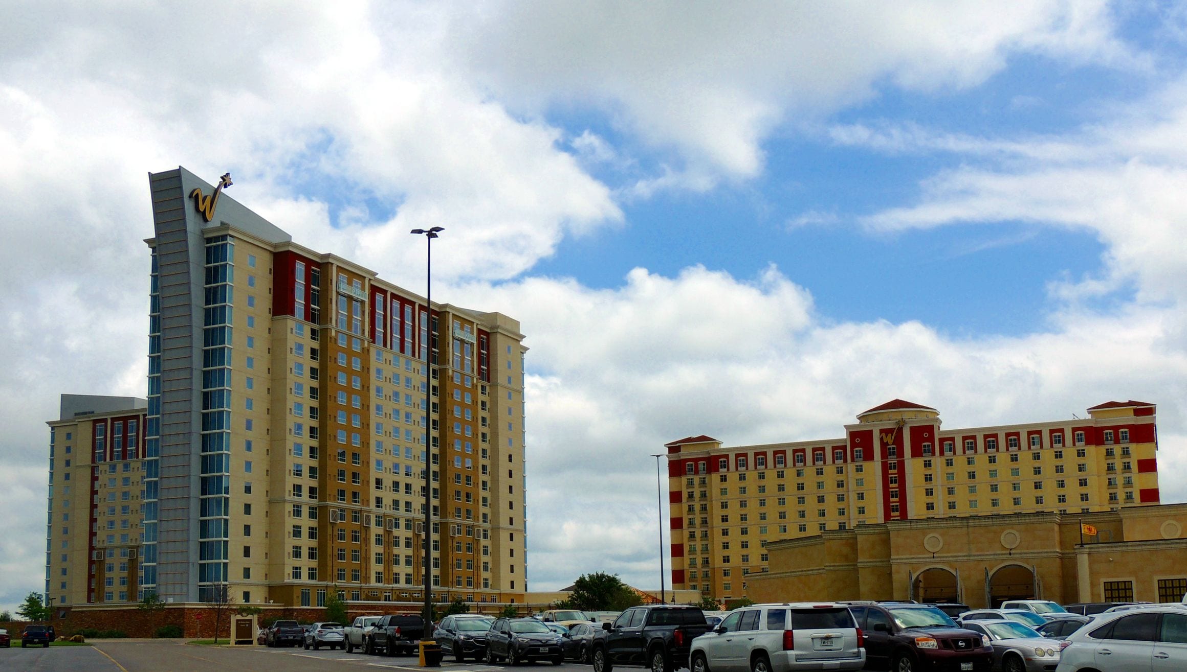 The WinStar hotel towers, crowned by the gold W logo, rising beside the casino complex at WinStar World Casino and Resort in Thackerville, Oklahoma