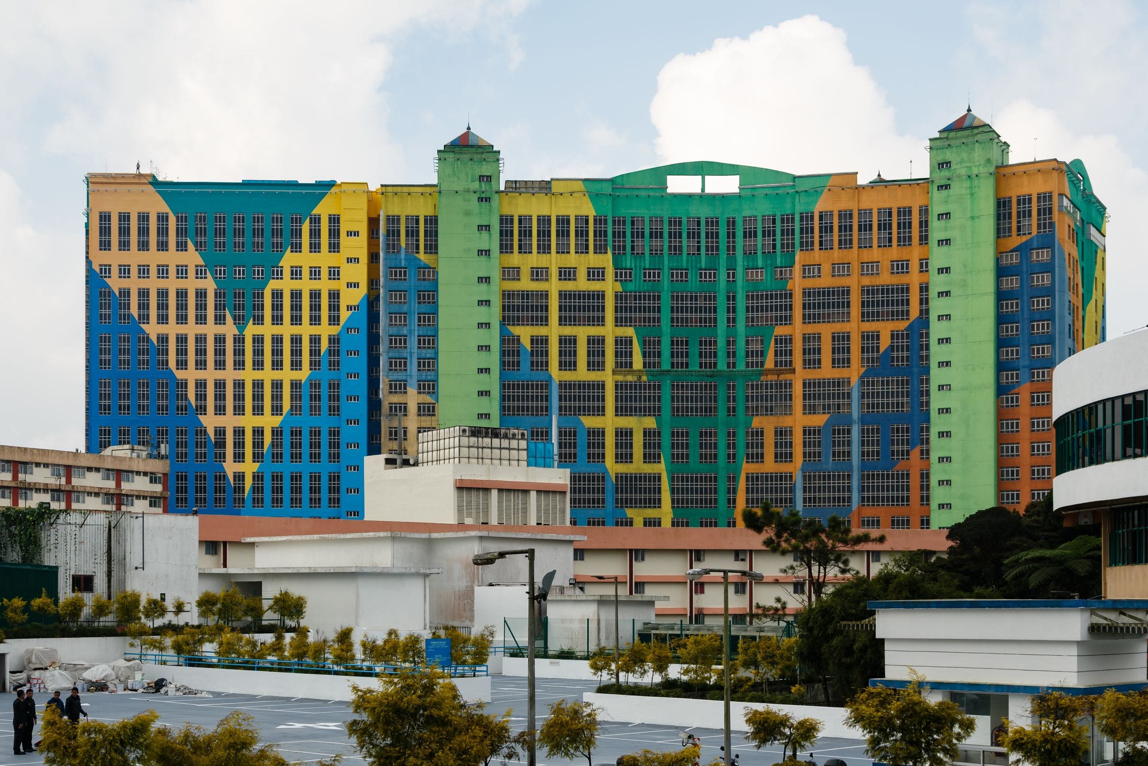 The patchwork blue, yellow, green and orange facade of the First World Hotel towering over Resorts World Genting in Malaysia's Genting Highlands