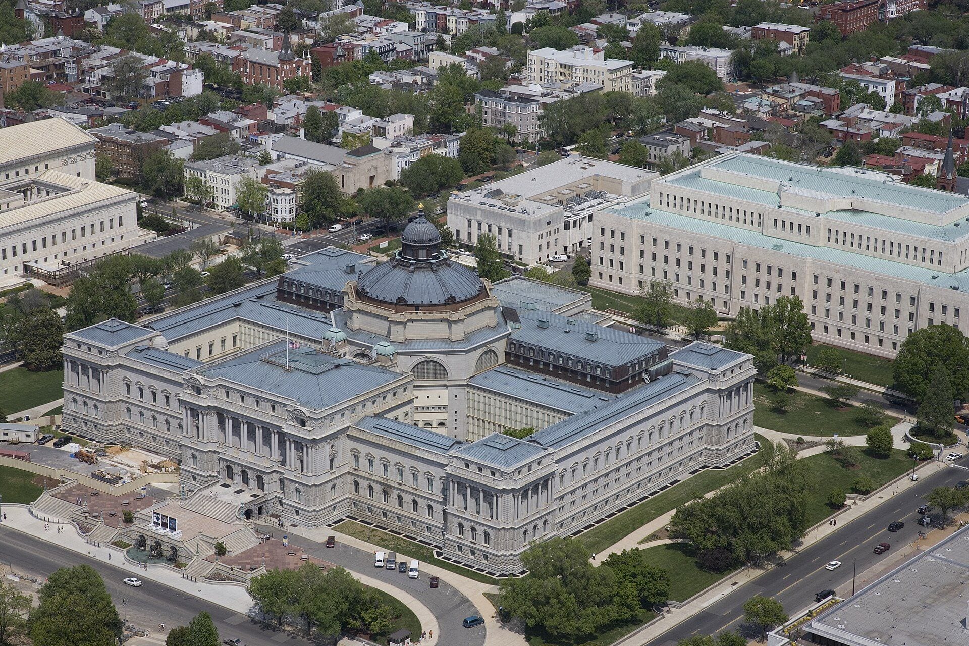 Aerial view of the Library of Congress Thomas Jefferson Building in Washington, DC, its copper-green dome rising above the grand stone wings
