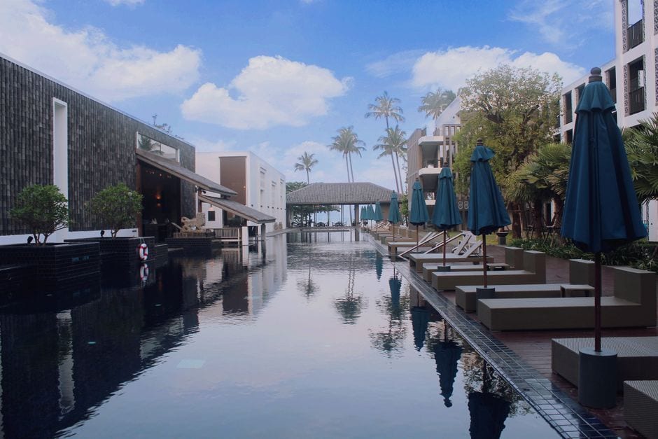 A large outdoor pool by the sea, illustrative of a luxury swimming lagoon