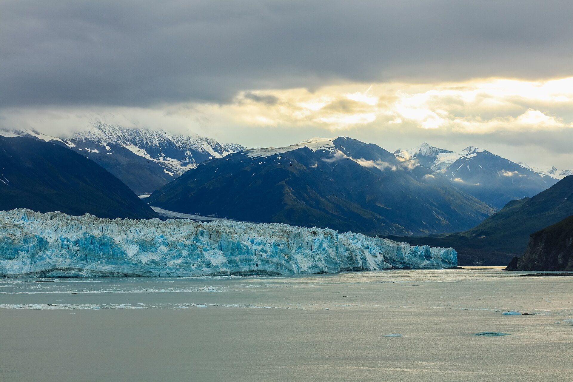 The blue ice front of Hubbard Glacier meeting Disenchantment Bay beneath the Saint Elias Mountains in Alaska