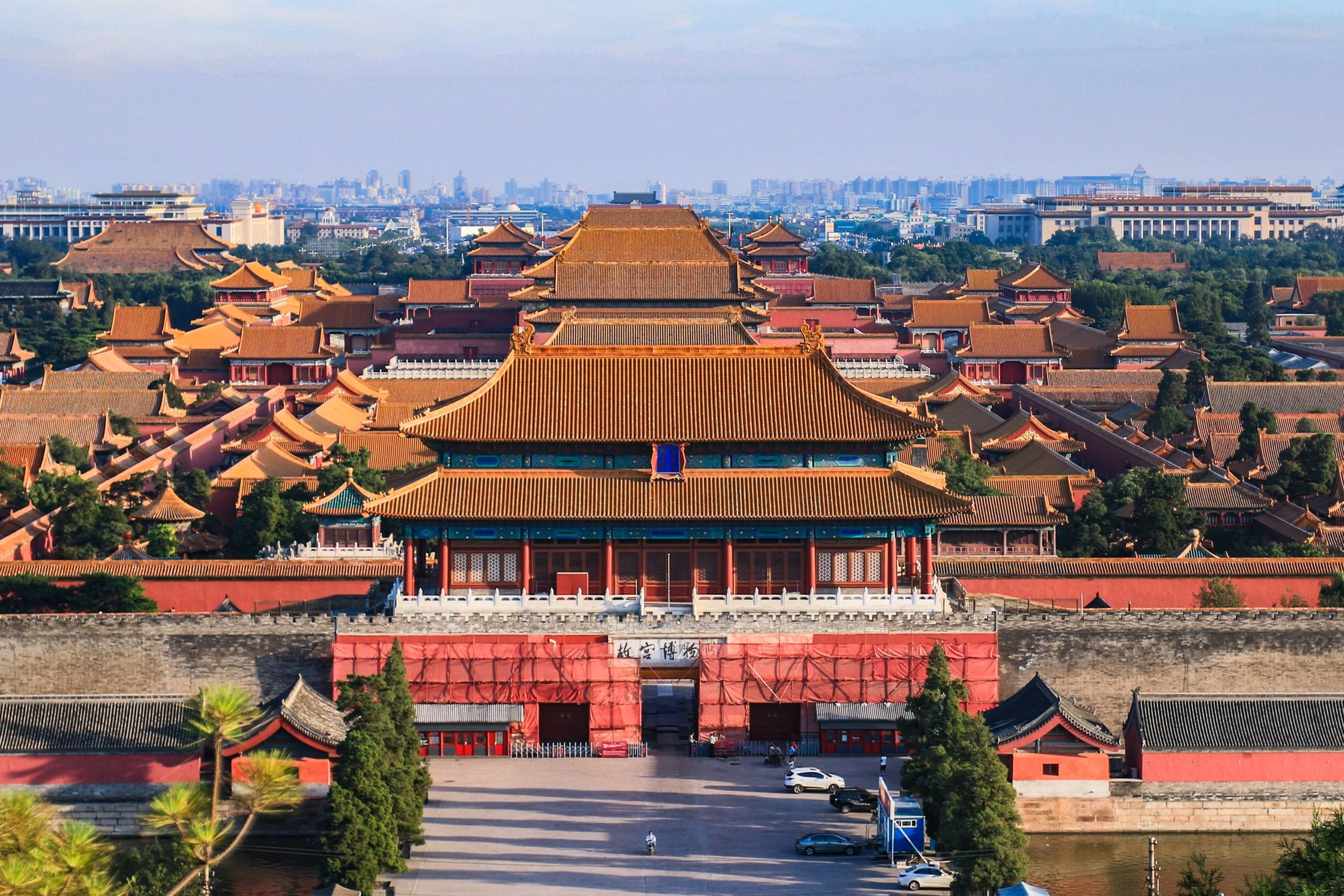The Gate of Divine Prowess and a sea of golden-tiled palace roofs of the Forbidden City in Beijing, seen from Jingshan Park