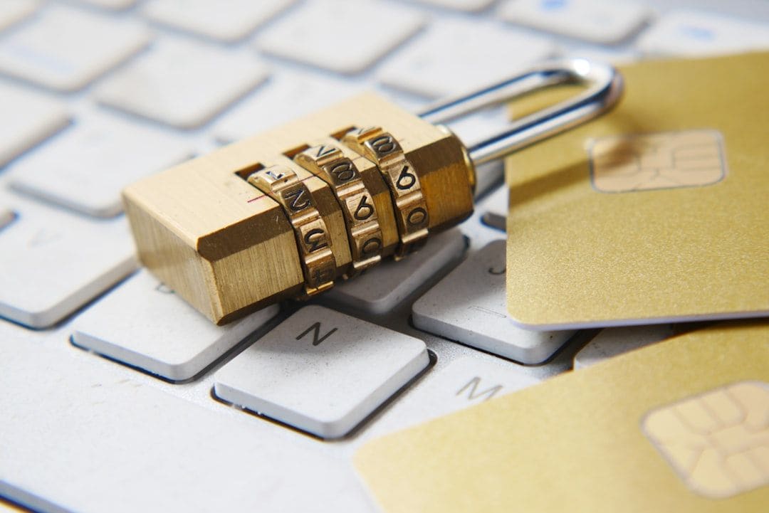 A combination padlock resting on a laptop keyboard, representing data privacy