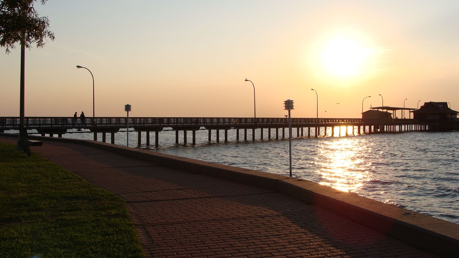 Fairhope Municipal Pier stretching out over Mobile Bay at sunset in Fairhope, Alabama