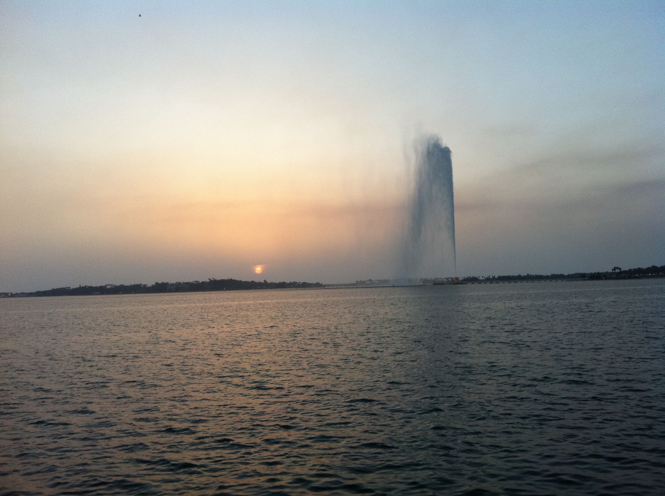 The towering jet of King Fahd's Fountain rising over the Red Sea at sunset off the Jeddah Corniche in Saudi Arabia