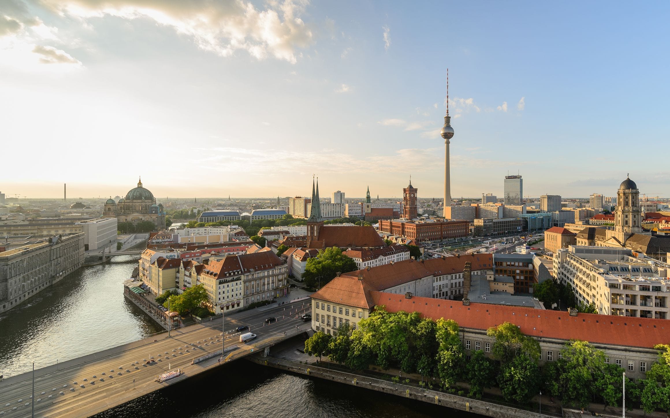 Berlin skyline at golden hour with the Spree river, Berlin Cathedral dome and the TV Tower rising over the city
