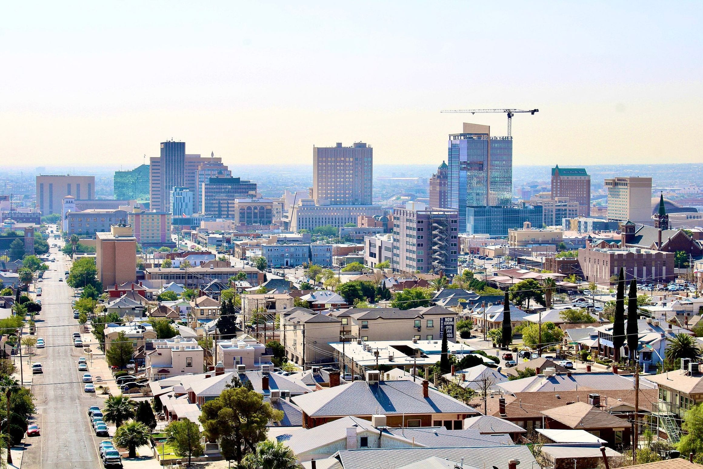 Downtown El Paso skyline seen from the north, with office towers rising above low residential streets