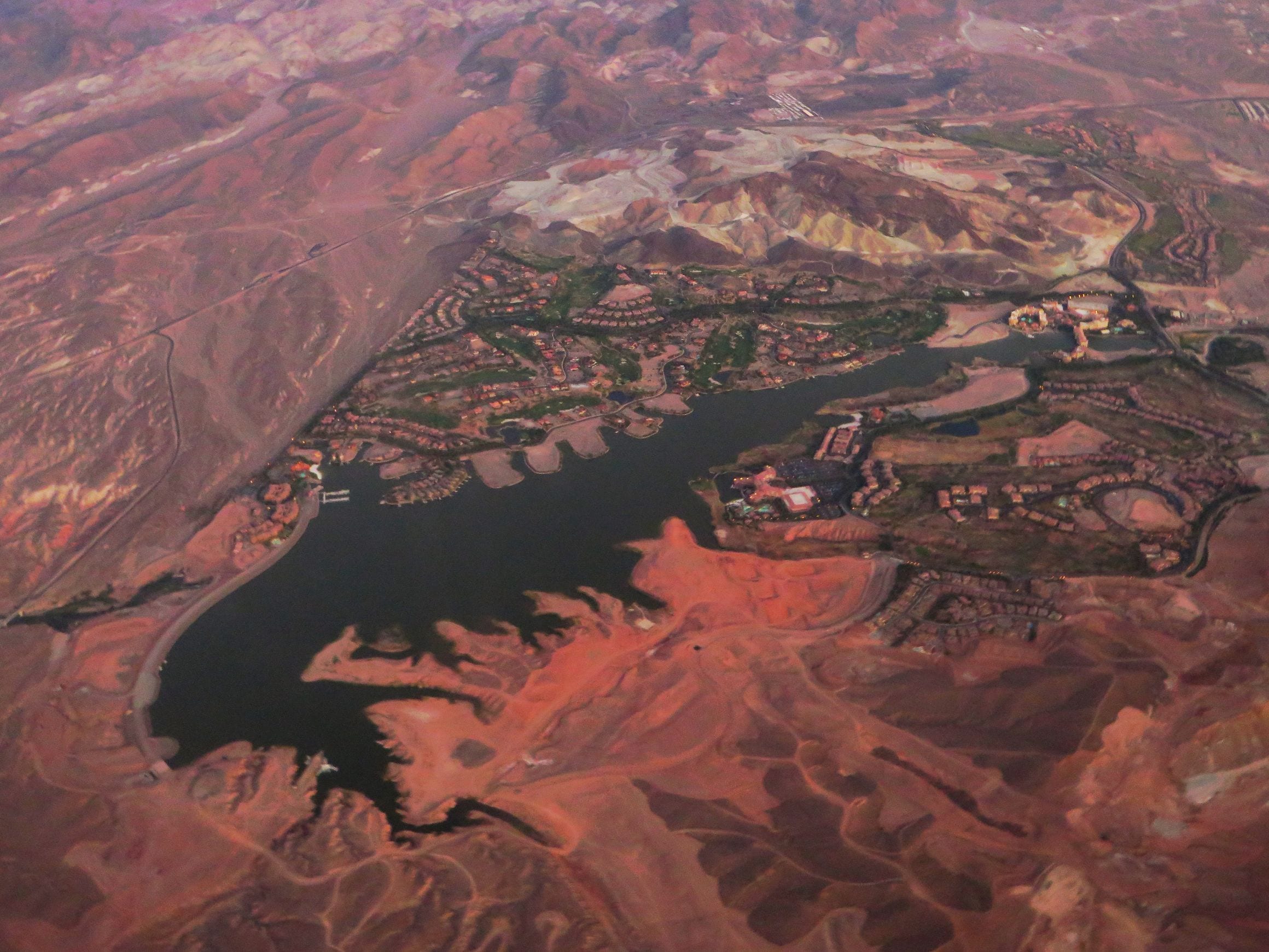 Aerial view of Lake Las Vegas in Henderson, Nevada, a winding lake ringed by red desert hills and resort development