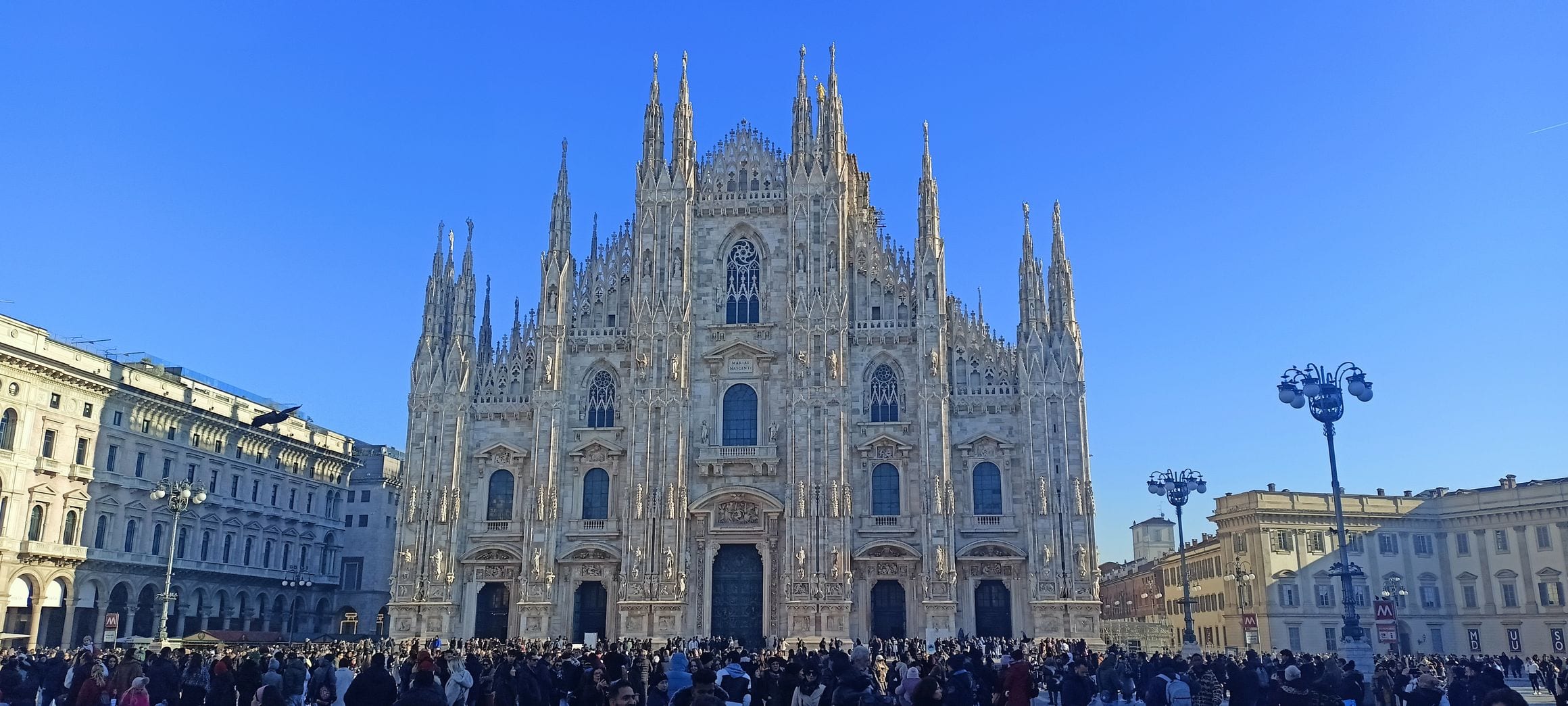 The Gothic facade of the Duomo di Milano above Piazza del Duomo in Milan